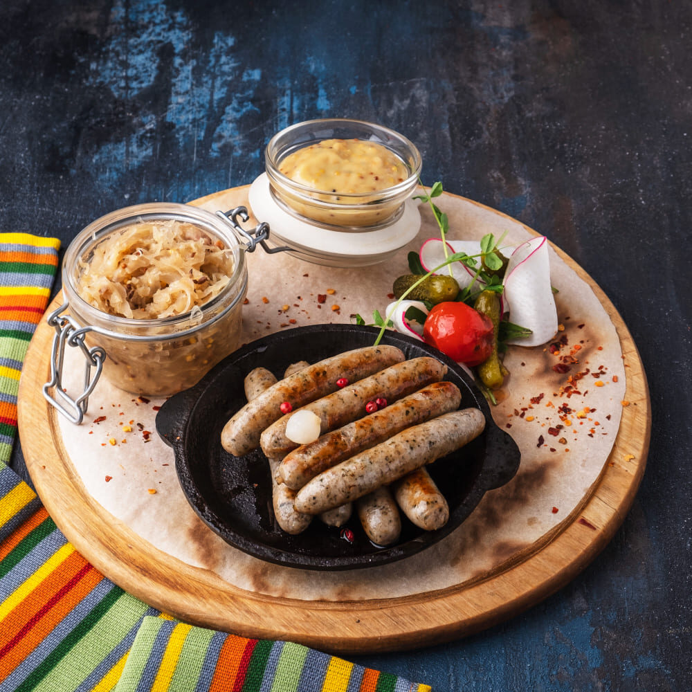 Chorizos mixto, especial y español de Colombo Alemana presentados con ingredientes frescos